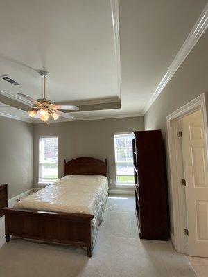 Painted walls and ceiling, touched up crown molding and baseboard on this master bedroom