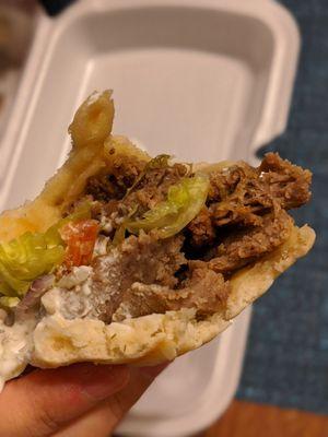 Inside a half eaten beef shwarma