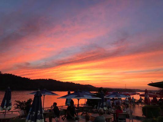 Sunset view over looking the outside patio while sitting on the deck near the Ohio River.