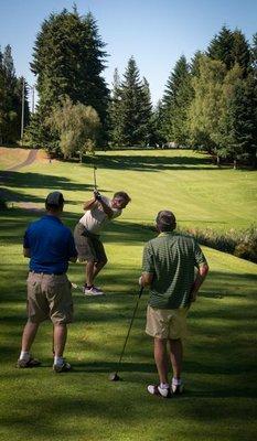 Hitting off the 3rd tee over the water at Meadowmeer Golf & Country Club.