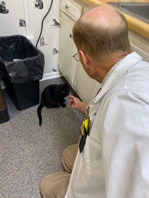 Dr. Miller giving Scooter a tasty vitamin treat.