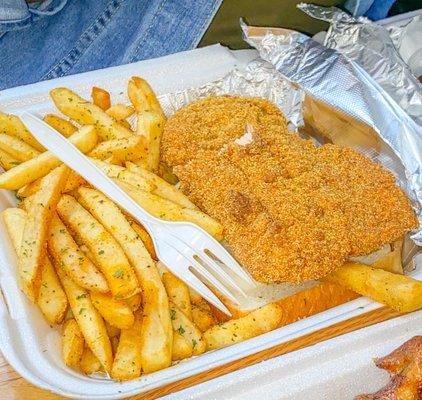 Cajun fried salmon fillet and fries