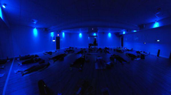 Students relaxing in Savasana