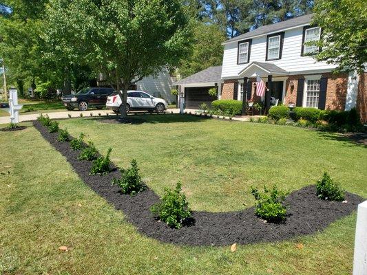 After completing the landscape, no debri left behind, nice clean, low maintenance, and giving the yard great curve appeal.