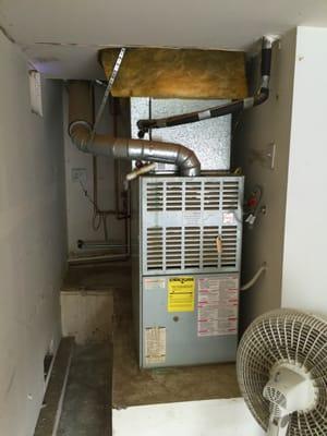 Tight quarters - track home builder left little space for a full-sized gas water heater - or REMOVING ONE...