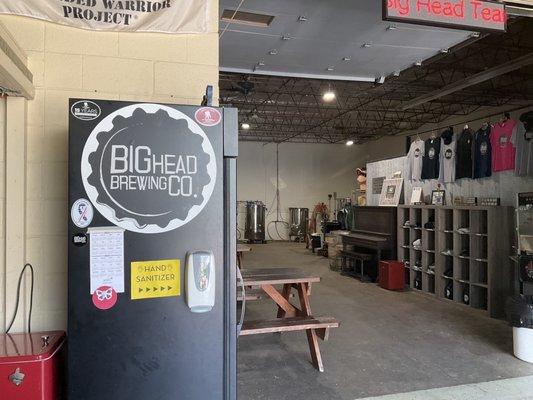 Open area and inside of brewery adjacent to bar.