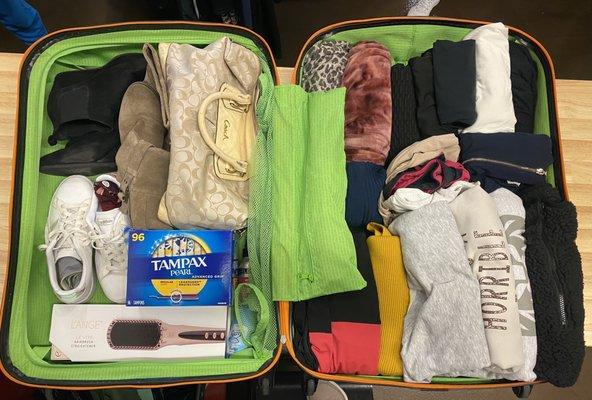 The Shopp packs suitcases full of clothing and basic essentials for women in need.