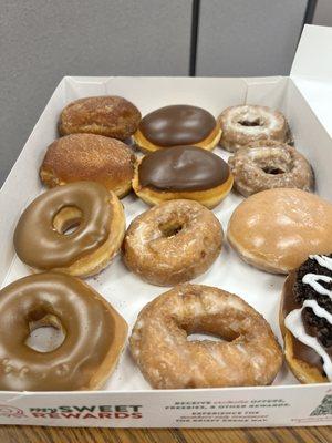 Variety with some filled, cake and glazed donuts