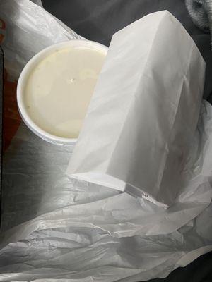 Cream gravy and bag with rolls