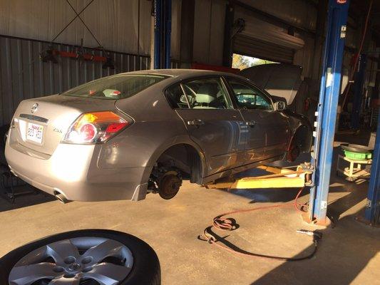 All four wheels removed to check a missing lug nut on rear drivers side.