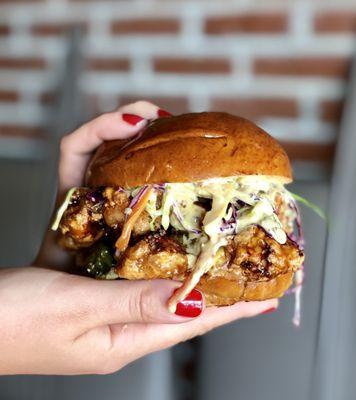 Spicy friend chicken sandwich with sweet and tangy habanero sauce