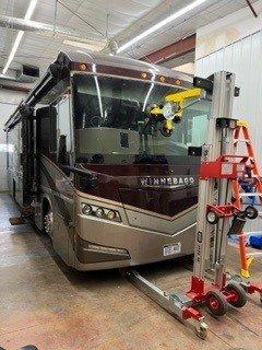 Using a machine to precisely set an RV windshield without damaging the vehicle or the glass!