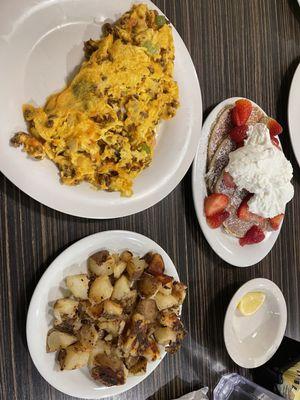 Chorizo scramble, home fries and strawberry pancakes