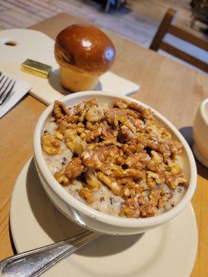 Multi grain porridge with banana jam and toped with walnuts.