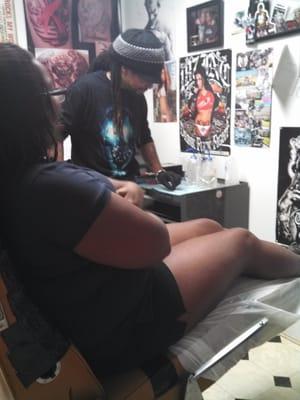 Shunda B's first ink!  She is smiling through the pain. lol