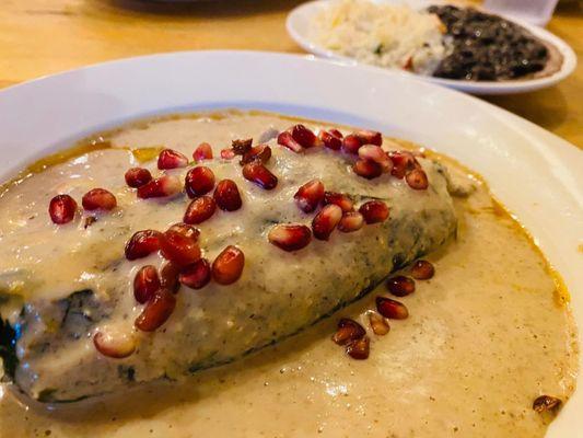 Poblano pepper stuffed with unique flavors topped with pomegranate