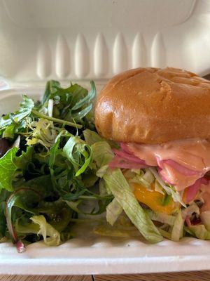 House burger with American cheese, arugula, pickled reds, house sauce, served with dressed greens, to go.