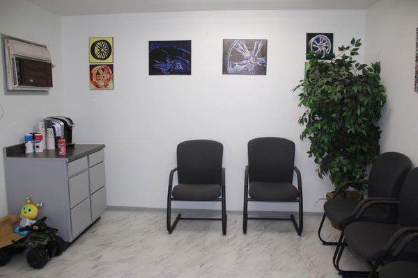 A Family friendly waiting room with coffee and Tv.