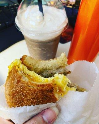 Breakfast bagel sausage sandwich with cookie crunch shake.