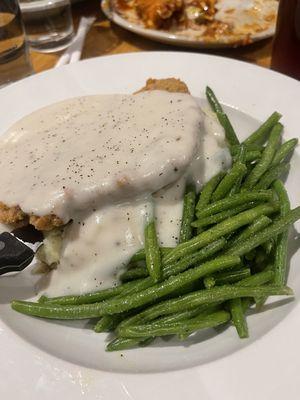 Chicken Fried Steam, green beans, on a bed of mashed potatoes