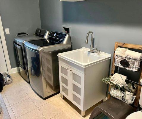 We installed high-efficiency washers & dryers for a sleek and functional laundry room.