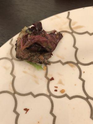 Rotting lettuce at bottom of salad.