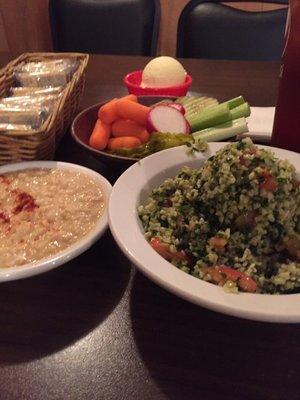 Hummus and Tabouli, also served with a cabbage roll, BBQ bologna and spareribs.