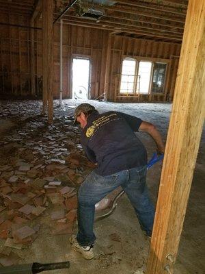 One of our services that helps prepare for a new building is demolition, gutting everything down to the studs.