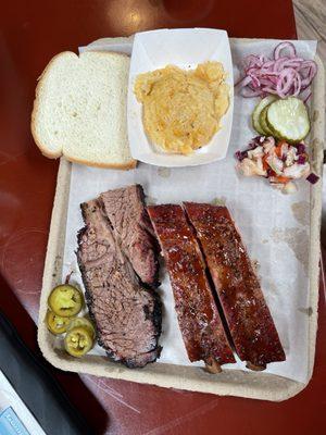 Two protein plate: brisket, ribs with Cheesy potatoes.