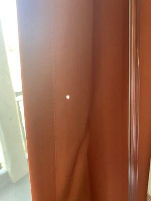 Hole in curtain