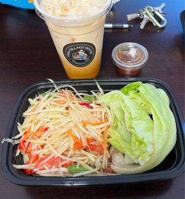 BLAND Thai papaya salad not as pictured in other photos, browning lettuce wedges, light flavored Thai tea, small sized cup for $5.00