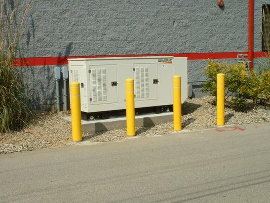 Generac 70kW Installation using concrete pad and bollards