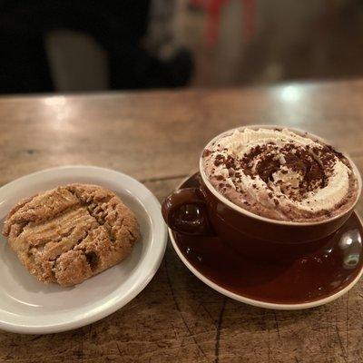 Vegan peanut butter cookie and hot chocolate