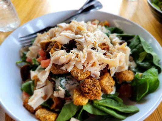 Spinach, turkey, bacon salad with maple bourbon dressing.