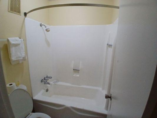 Very  Very small, no shower curtain tub spicket  a huge amount leaked from shower knob  and 1 set of towels for  2 people to use