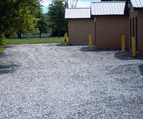 All buildings are concrete block, concrete floors, double roofs, large roll-up doors.