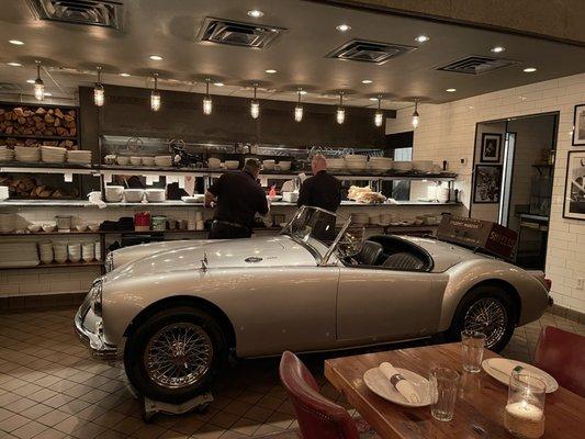 Beautifully restored 1953 MG Spider in front of the kitchen