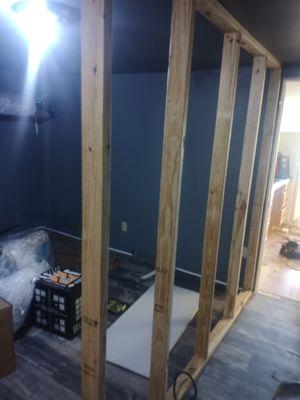 Installation of added wall in a large bedroom