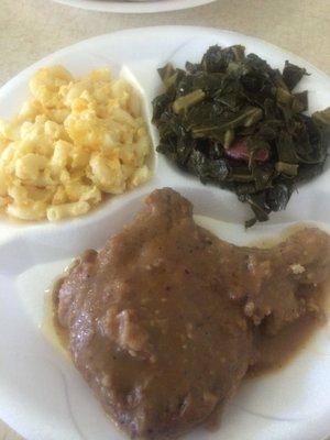 Smothered pork chop, collard greens and mac& cheese