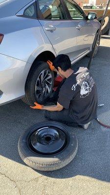 Aaron putting back our patched tire.