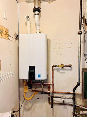 A new Navien 240A2 Tankless Water Heater installation with built-in recirculating pump.