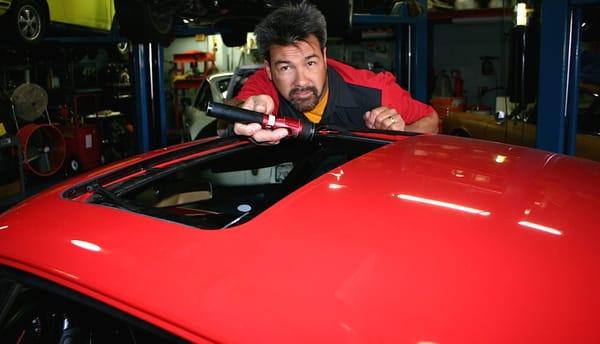 David repairing a leaking sunroof.