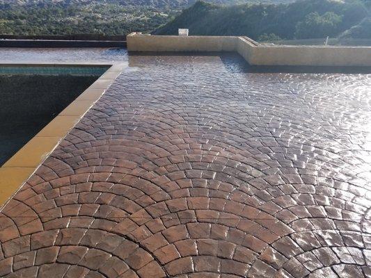 European fan stamped texture on pool deck.