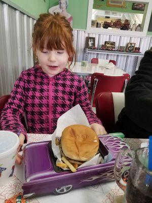 The kids meals are served in classic cars.