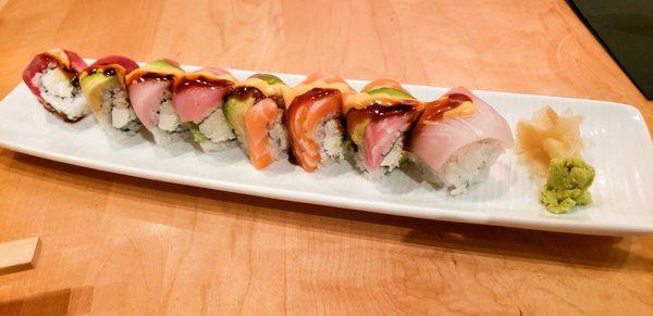 YZ Roll: Blue crab, avocado, and cream cheese, topped with tuna, salmon, yellowtail, whitefish, spicy mayo, and eel sauce.