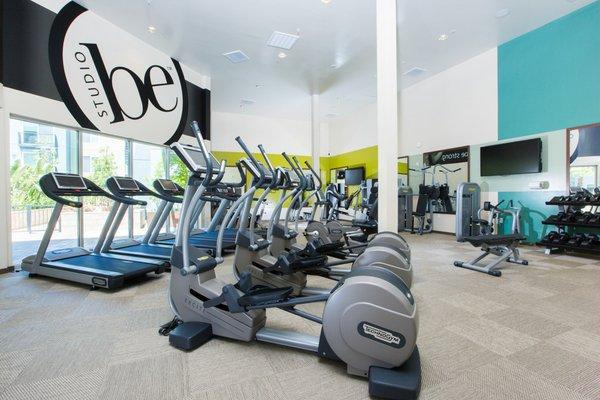 Community fitness center featuring cardio and strength training equipment.