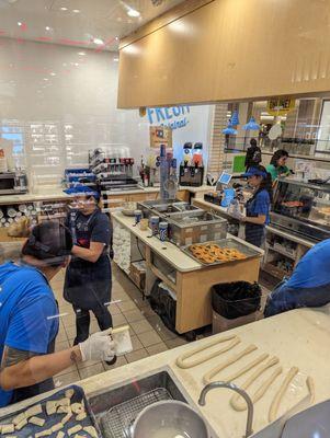 Walking by the glass and seeing all the Pretzel elves working hard at Christmas time convinced me