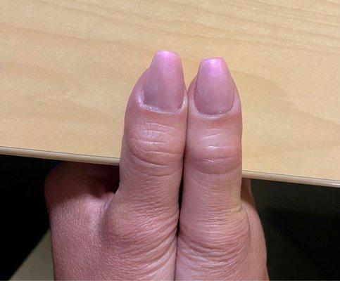 Left nail is long and thin, the right is fat and short.