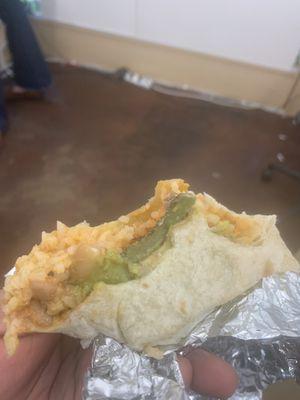 Burrito with avocado skin inside.