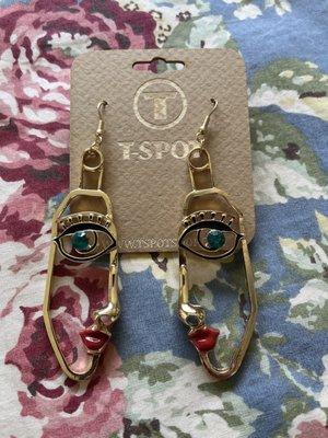 A pair of face earrings